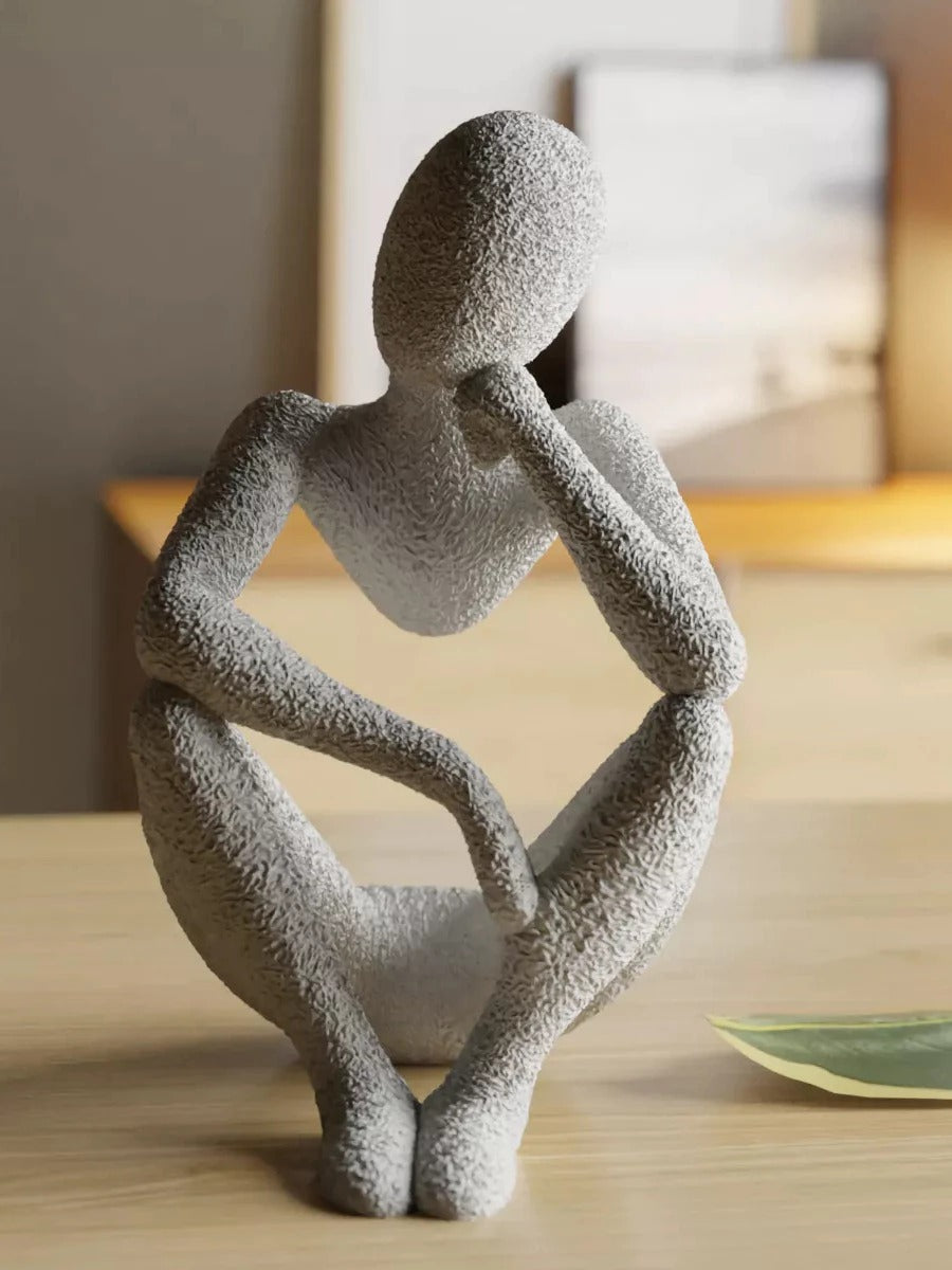 ESTATUA MULHER SENTADA ALÉM DA VISÃO