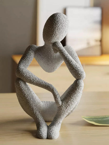 ESTATUA MULHER SENTADA ALÉM DA VISÃO