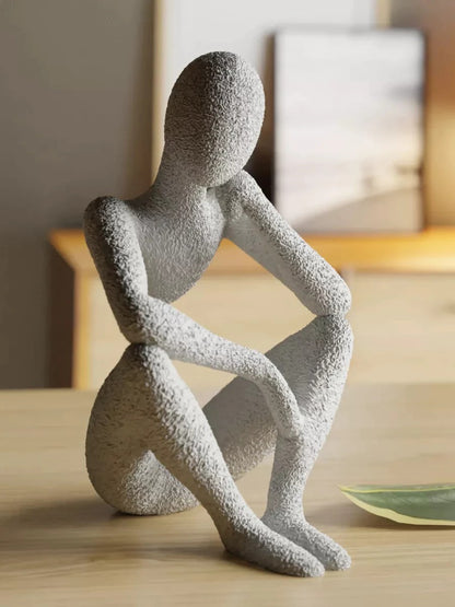 ESTATUA MULHER SENTADA ALÉM DA VISÃO